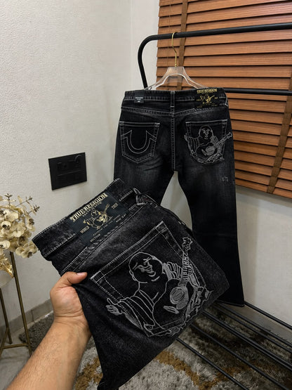 TRUE RELIGION IMPORTED POCKET HEAVY EMBROIDERED BOOT CUT DENIM*