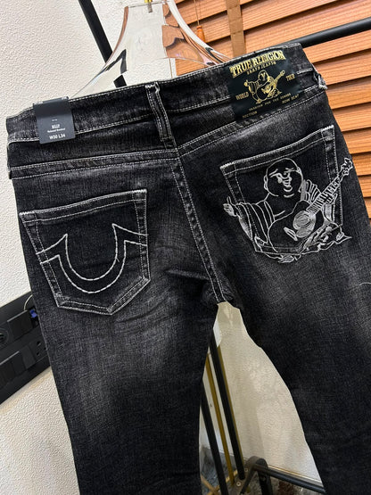 TRUE RELIGION IMPORTED POCKET HEAVY EMBROIDERED BOOT CUT DENIM*