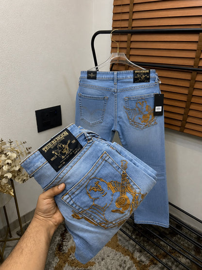 TRUE RELIGION IMPORTED POCKET HEAVY EMBROIDERED BOOT CUT DENIM*