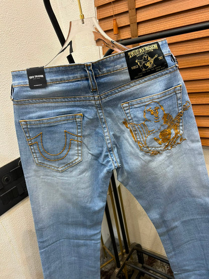 TRUE RELIGION IMPORTED POCKET HEAVY EMBROIDERED BOOT CUT DENIM*