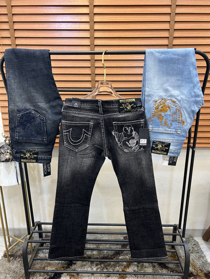 TRUE RELIGION IMPORTED POCKET HEAVY EMBROIDERED BOOT CUT DENIM*